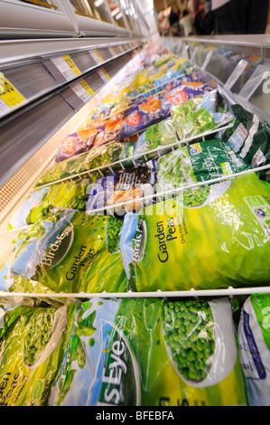 Freezers with frozen vegetables at Morrisons Supermarket shop floor in the UK. Stock Photo