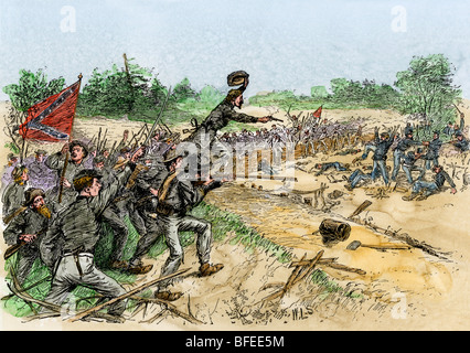 Confederates capturing a Union position at Chancellorsville, 1863. Hand-colored woodcut Stock Photo