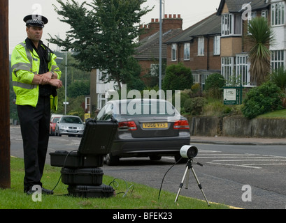Police officer uses a mobile ANPR set up Stock Photo