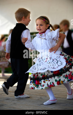 Young Svab children in traditional dress dancing at the wine harvest festival , Hajos (Haj s) Hungary Stock Photo