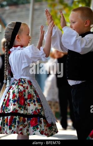 Young Svab children in traditional dress dancing at the wine harvest festival , Hajos (Haj s) Hungary Stock Photo