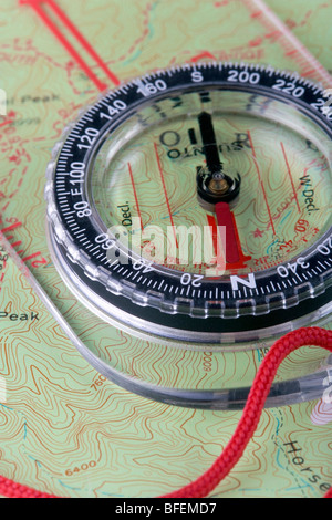 A hiking compass on a Topo map Stock Photo