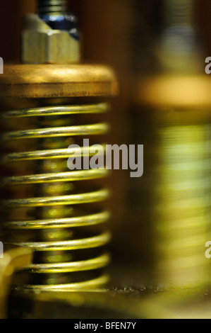 Closeup of the spring mechanism inside a relay switching device Stock Photo