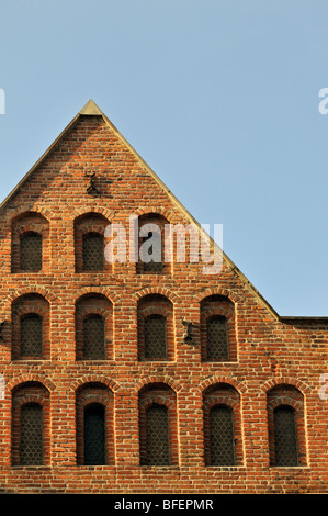 Architectural Detail of Multi-Storey Red Brick House Gable, Plac Marii Magdaleny, Krakow, Poland Stock Photo