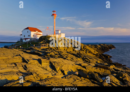 Cape Forchu Lightstation near Yarmouth Nova Scotia Canada. beam from its 23 metre/75 foot high lighthouse may be seen 30 nautica Stock Photo