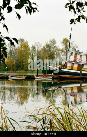 S.S. Master docked at Steveston, BC, with three row boats. Stock Photo