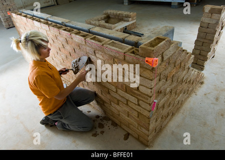 Girl student learning practical bricklaying  at 'City College Brighton'
