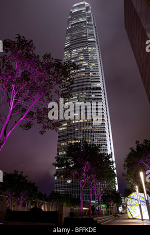 An atmospheric night view of Hong Kong's Two International Finance Centre's (2 IFC) illuminated office tower. Stock Photo