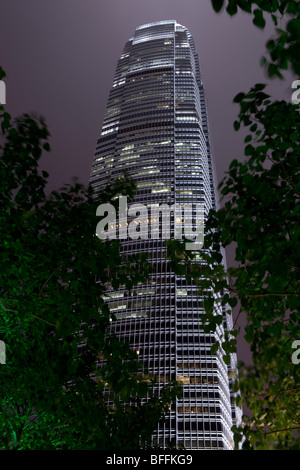 An atmospheric night view of Hong Kong's Two International Finance Centre's (2 IFC) illuminated office tower. Stock Photo