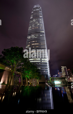 An atmospheric night view of Hong Kong's Two International Finance Centre's (2 IFC) illuminated office tower. Stock Photo