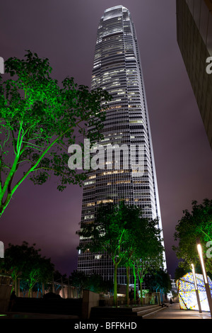 An atmospheric night view of Hong Kong's Two International Finance Centre's (2 IFC) illuminated office tower. Stock Photo