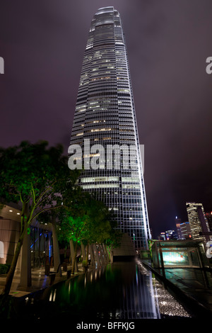 An atmospheric night view of Hong Kong's Two International Finance Centre's (2 IFC) illuminated office tower. Stock Photo