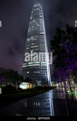 An atmospheric night view of Hong Kong's Two International Finance Centre's (2 IFC) illuminated office tower. Stock Photo