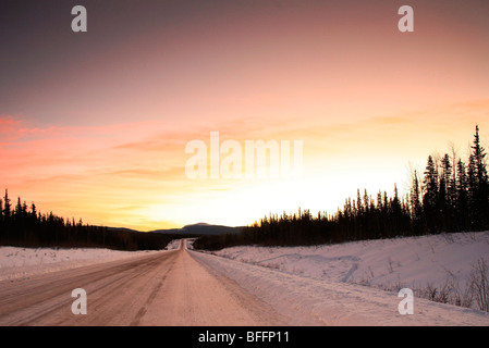 Sunrise over Alaska Highway, south of Teslin, Yukon. Stock Photo