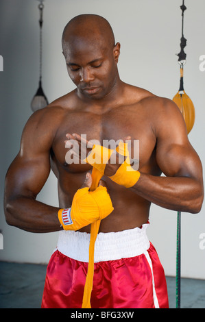 Boxer Taping Hands Before Fight Stock Photo