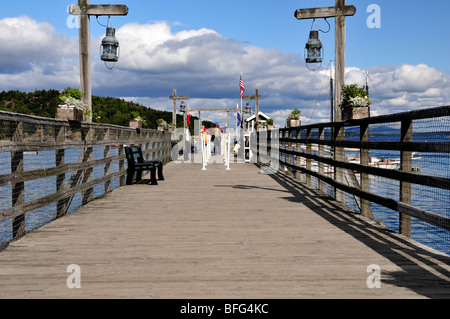 A pier juts out in Frenchman's Bay,  Atlantic ocean from the shore of Bar Harbor, Maine, on Mt. Desert Island, USA Stock Photo