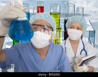 Asian woman and man working in a medical lab Stock Photo