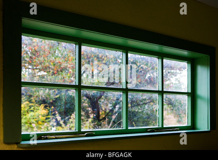 White window of The Boathouse Tearoom seen from the inside at the Priest's House Museum gardens in Wimborne, Dorset Stock Photo