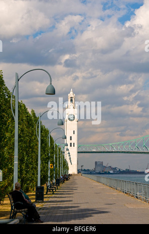Old Port of Montreal Clock tower and Jacques Cartier Bridge Stock Photo