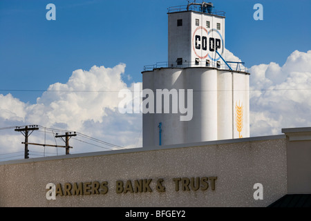 Oberlin Kansas American Midwest, the COOP grain elevator with Farmers Bank & Trust in the foreground. Stock Photo