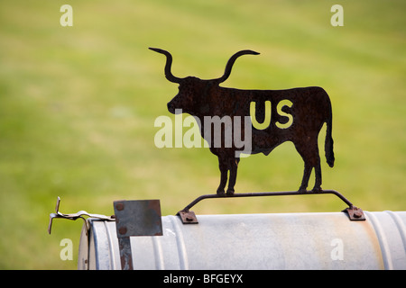 American US-Mail box decorated with cattle silhouette in Nebraska USA Stock Photo