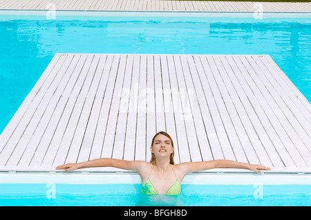 Young Woman relaxing in Swimming Pool, high angle view Stock Photo
