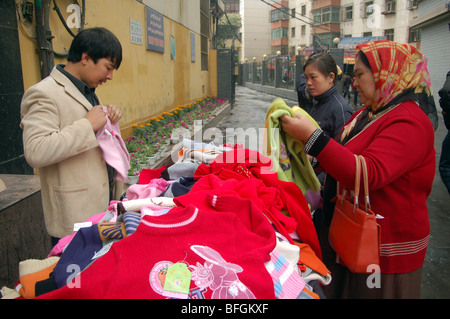 Uyghur people in the street markets of Urumqi, Xinjiang, CHINA Stock Photo