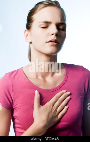 young woman with breathing problem Stock Photo