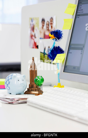 Souvenirs on Desk by computer in office Stock Photo