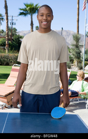 Young man playing table tennis, portrait Stock Photo