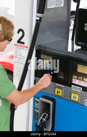 Man operating fuel pump payment kiosk Stock Photo - Alamy