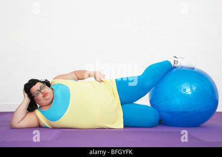 Overweight Woman Doing Gymnastics Stock Photo
