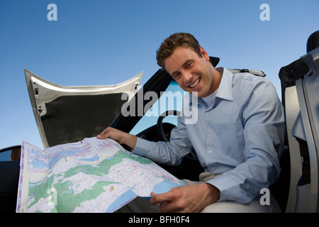 Man Looking at Map Stock Photo