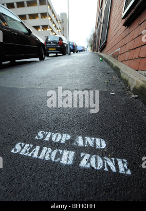 STOP AND SEARCH ZONE SIGN ON A STREET PAVEMENT IN BIRMINGHAM UK.
