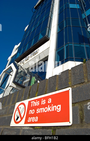 this is a no smoking area sign outside an office building on the great west road, brentford, london, england Stock Photo