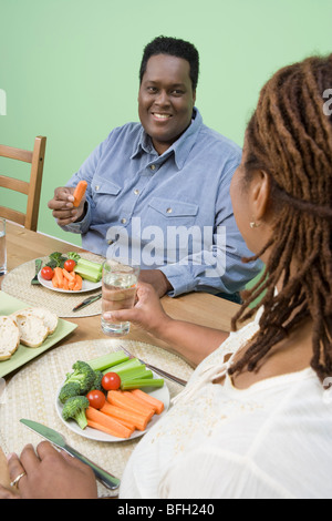 Overweight mid-adult couple having healthy meal Stock Photo