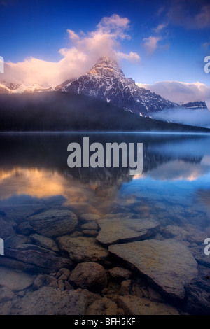 Mount Chephren is reflected in Water Fowl Lake along the Icefields Parkway in Banff National Park, Alberta, Canada Stock Photo