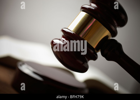juridical concept with hammer and lawbook, selective focus on metal part,toned f/x Stock Photo