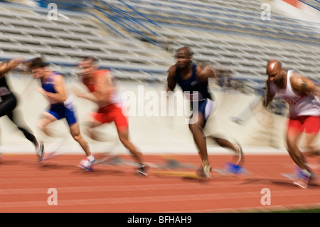 Runners running on a track Stock Photo
