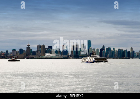 A Seabus crosses the Vancouver harbour towards downtown Vancouver. Stock Photo