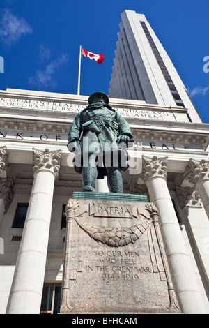 World War one soldier statue and Bank of Montreal buildings.  Portage and Main, downtown Winnipeg, Manitoba, Canada. Stock Photo