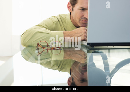 Business man using laptop in office Stock Photo