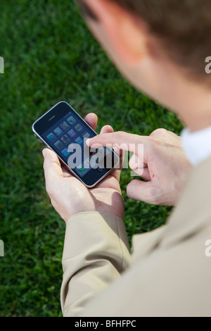 a man using an Iphone Stock Photo