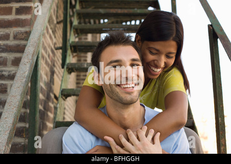 Young Couple on Fire Escape Stock Photo