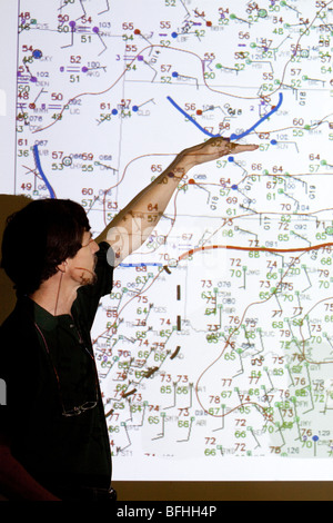 Doctor Eric Rasmussen points at a weather forcast map in Wichita, Kansas, USA, June 9, 2009 Stock Photo