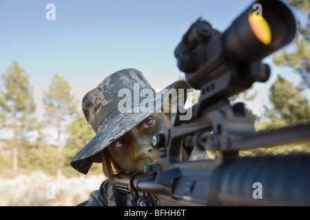 Soldier in pointing rifle Stock Photo