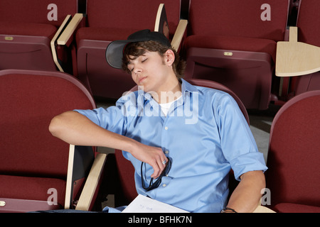 male college student sleeping in classroom Stock Photo