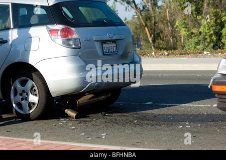 Car accident showing rear end damage to a compact car. Stock Photo