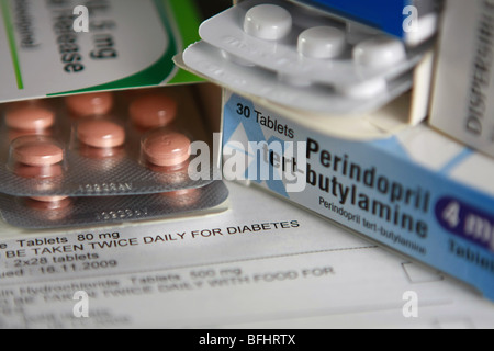 boxes of diabetic tablets and prescription with parts of blister packs of felogen and gliclazide tablets visible Stock Photo