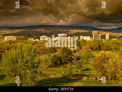 USA, IDAHO, Scenic view of the City of Boise Skyline & Ann Morrison Park in foreground. Storm clouds over  the Boise Front. Stock Photo